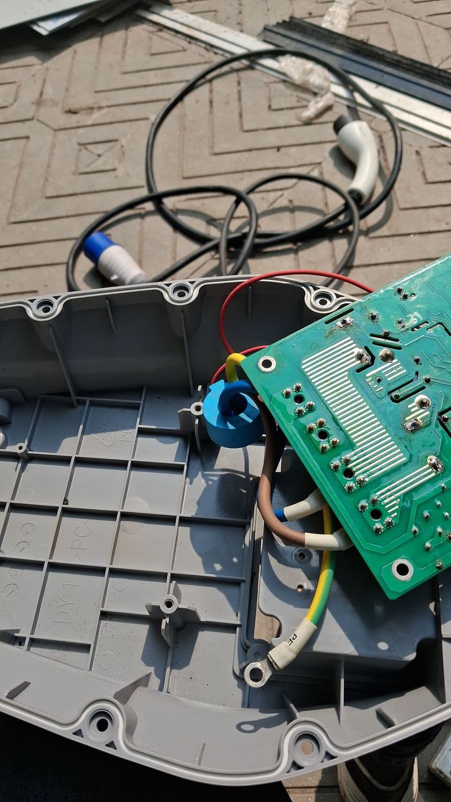 Charging-gun control board on the repair bench