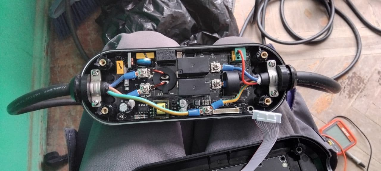 Charging connector opened for contact service