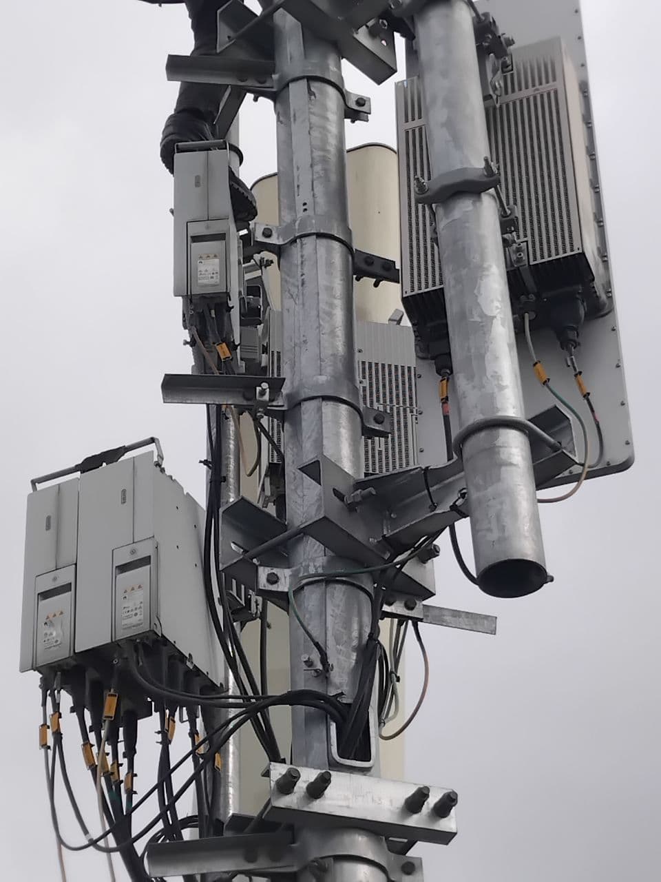 Monopole radios mounted and cabled