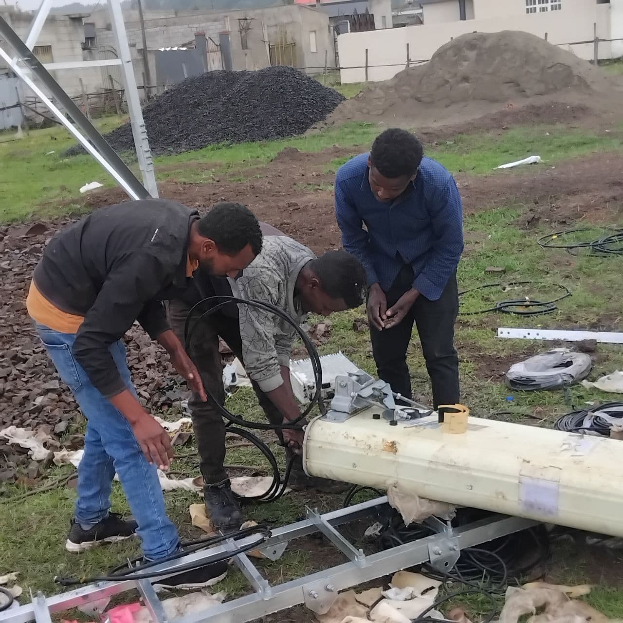 Ground crew preparing the mast base